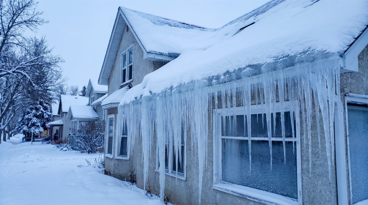Snow load and ice dam on an Edmonton roof in winter